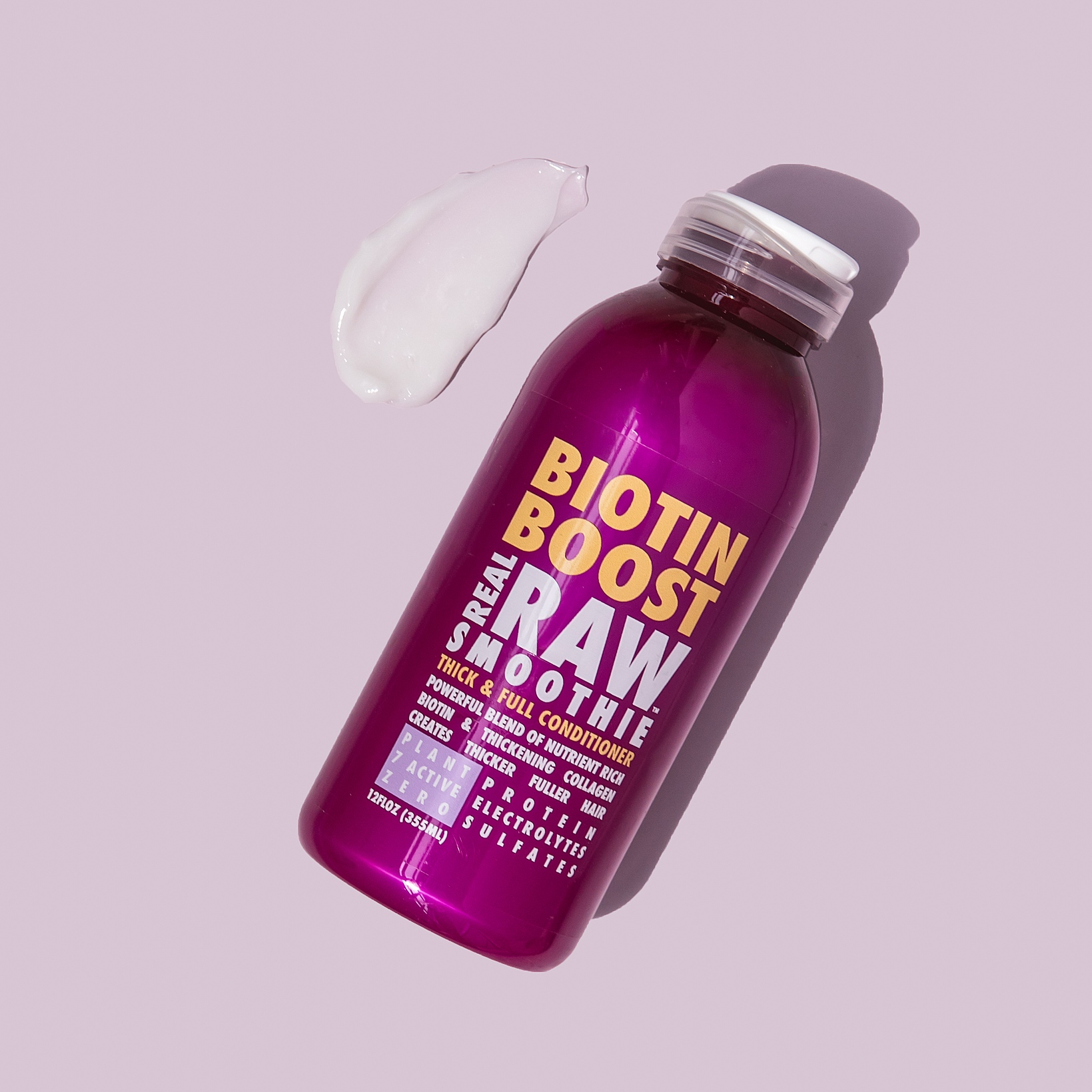 Bottle of Biotin Boost Raw Smoothie on a light purple background