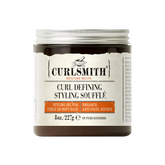 A jar of Curlsmith Curl Defining Styling Souffle with product information and branding visible on the label.