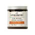 A jar of Curlsmith Curl Defining Styling Souffle with product information and branding visible on the label.