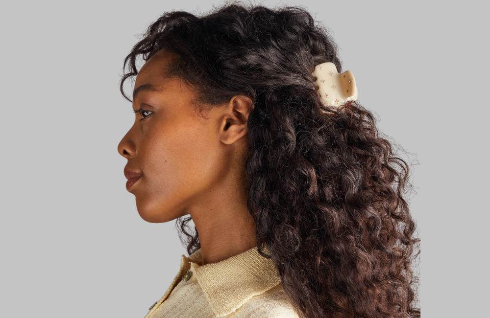 kitsch claw clip styled on curly brown hair