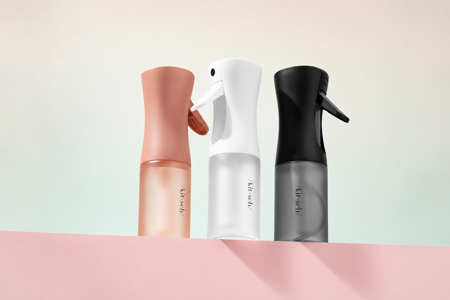 hair misting spray bottles in peach, white and black