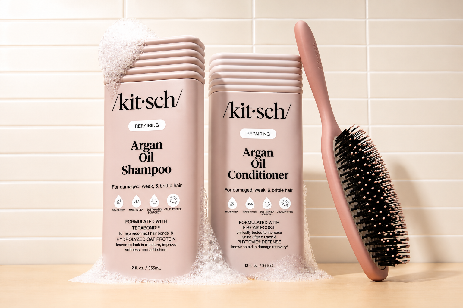 kitsch argan repairing bundle set shampoo and conditioner on a tiled background