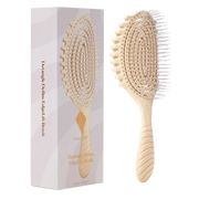 A bounce curl detangle define edgelift brush or paddle hairbrush shown next to its white and pale pink packaging box on a plain white background by Bounce Curl. 