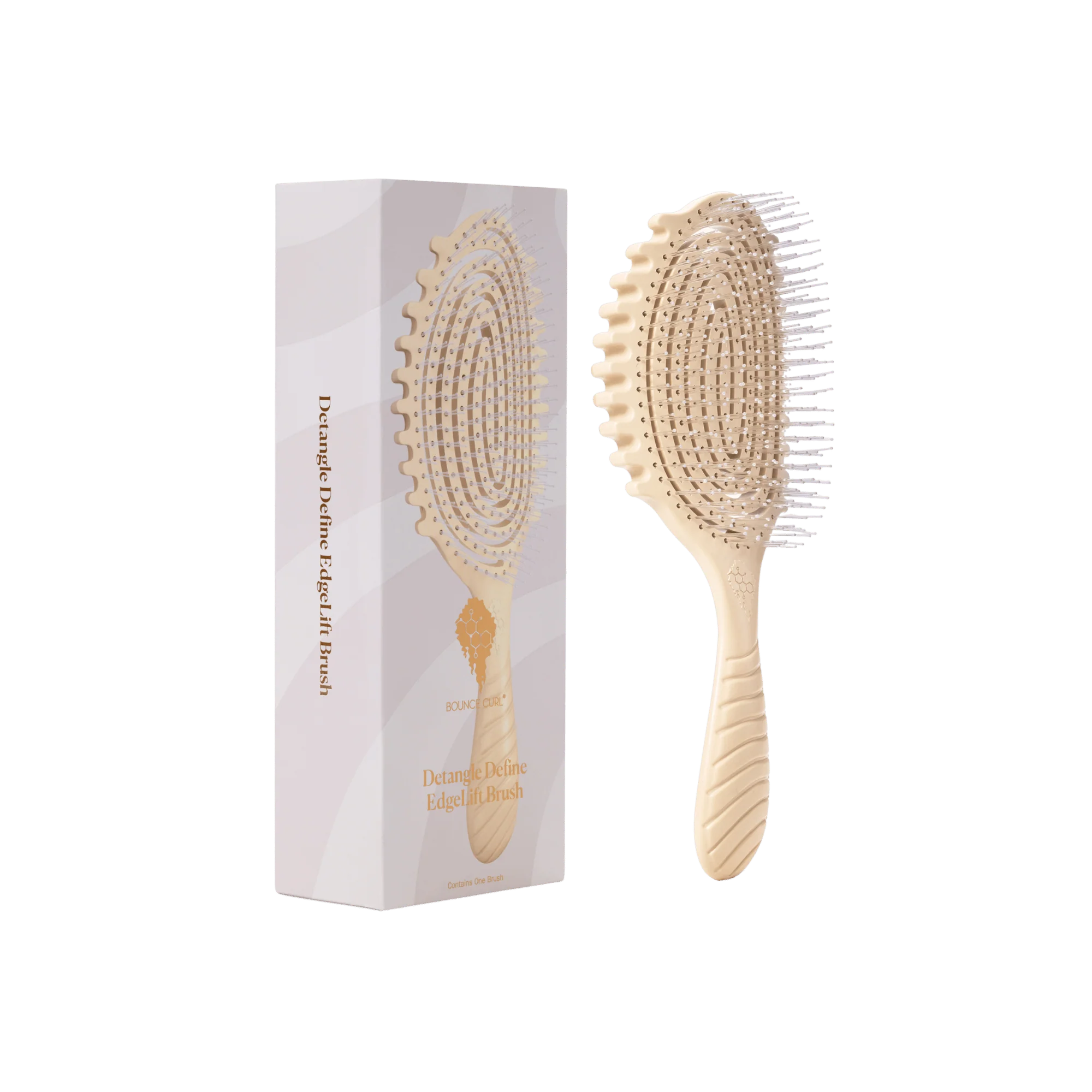 A light natural wood paddle hairbrush shown next to its white and pale pink packaging box on a plain white background by Bounce Curl. 