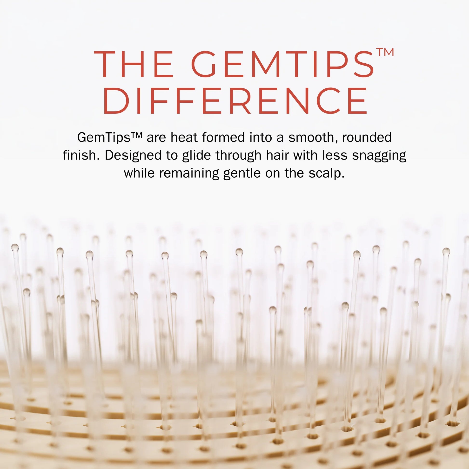 Close-up of a hair-building brush bristle tip with text reading 'THE GEMTIPS DIFFERENCE' and a descriptive feature callout on a white background.