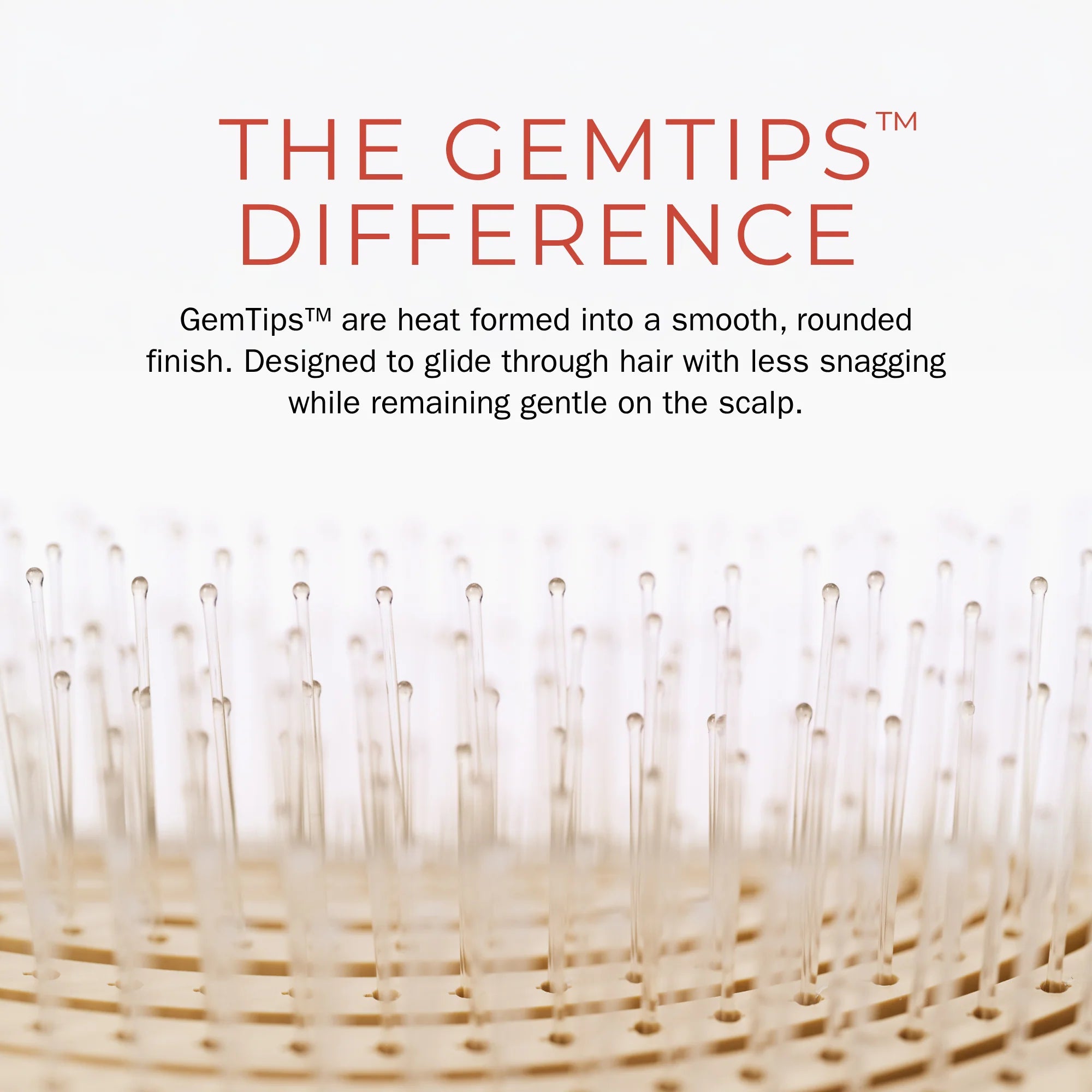 Close-up of a hair-building brush bristle tip with text reading 'THE GEMTIPS DIFFERENCE' and a descriptive feature callout on a white background.