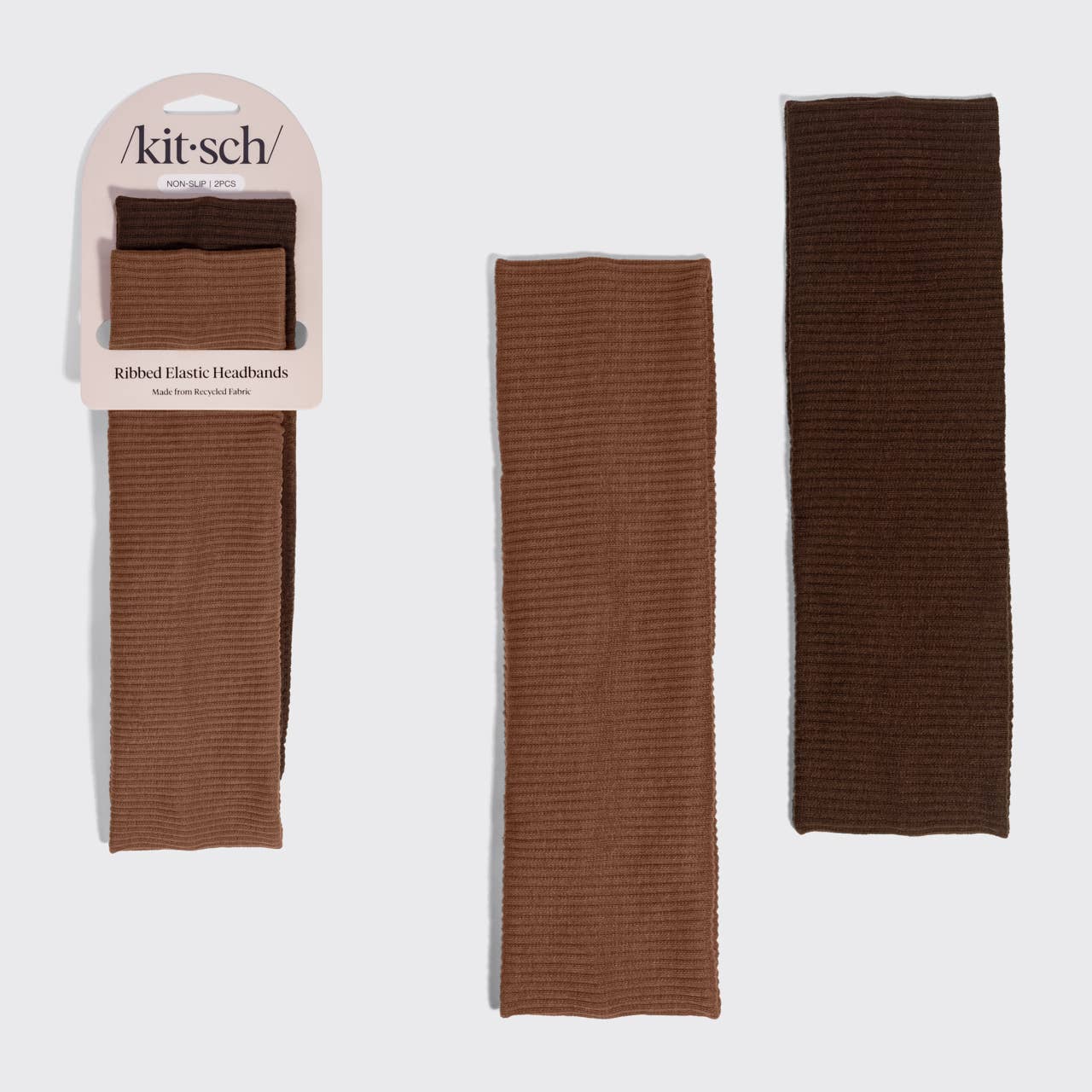 Three ribbed elastic headbands in brown tones from Kit Sch, shown with one in retail packaging on the left and two laid flat on the right against a light gray background.