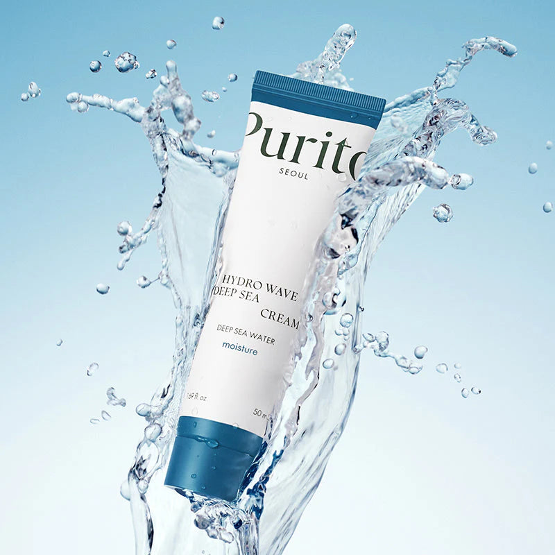 Tube of Purite Deep Sea Cream surrounded by water splashes on a light blue background