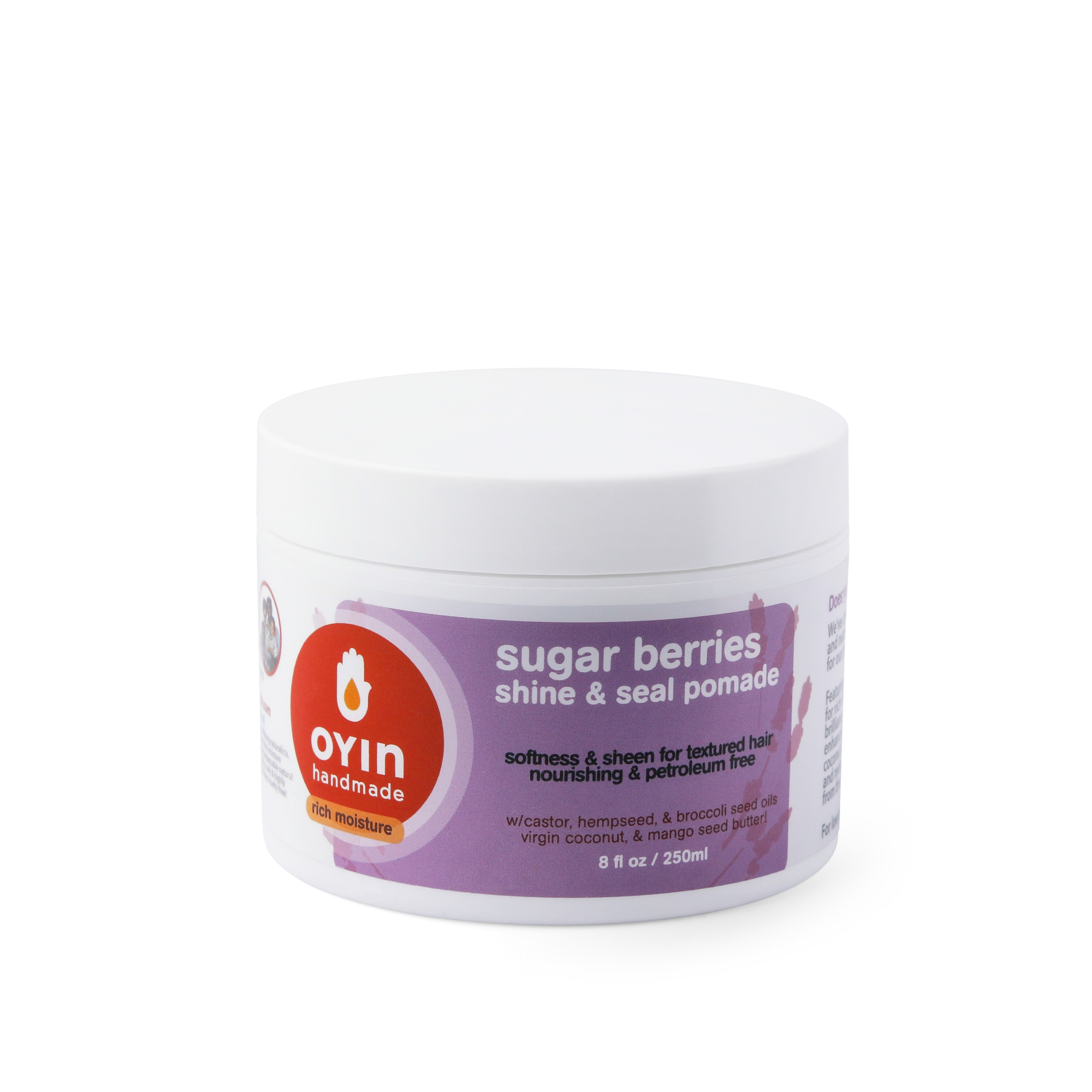 A container of Oyin Handmade Sugar Berries Pomade with the label visible. The container is white with a red and purple label that includes the product name and description.