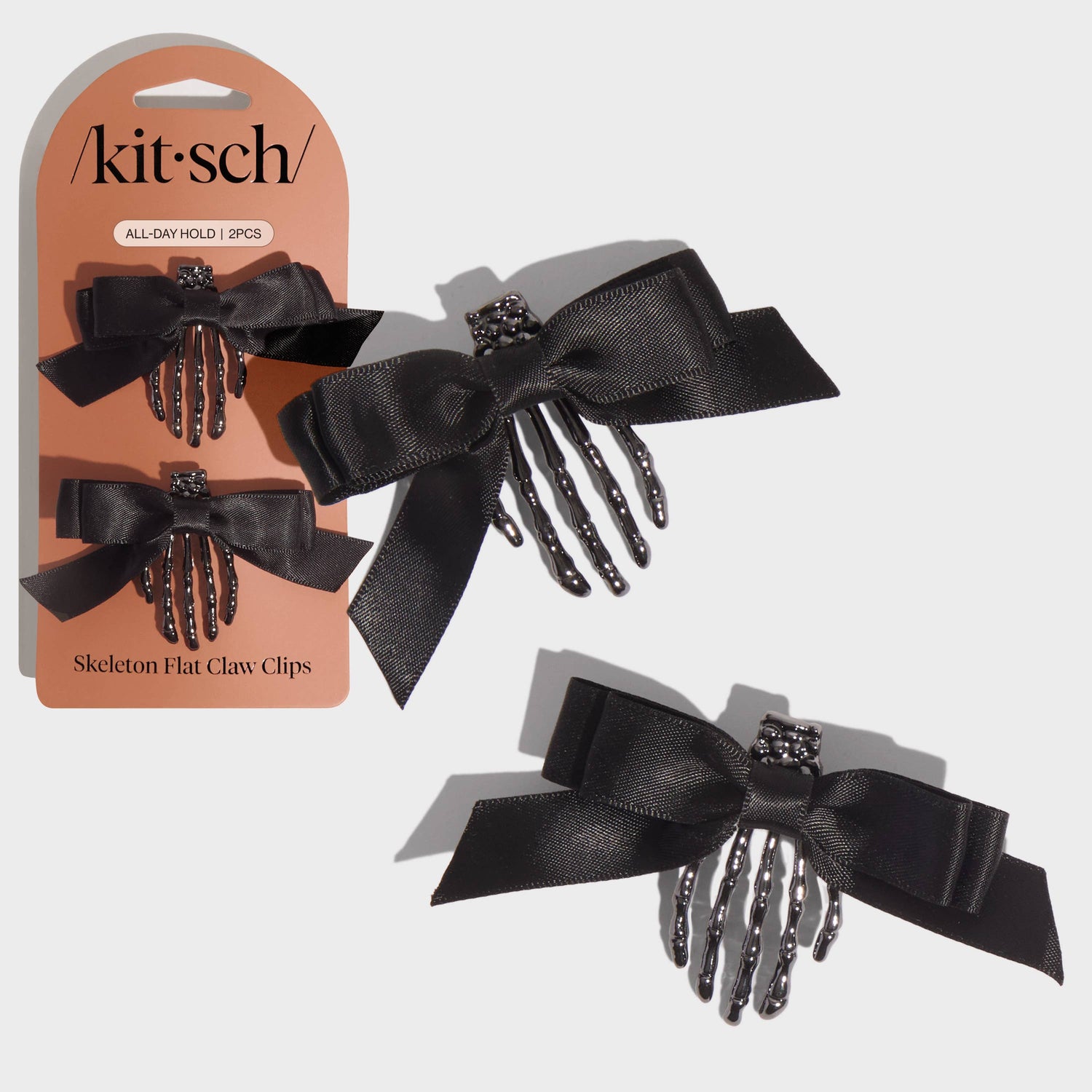 Black skeleton hand hair clips with packaging on a white background
