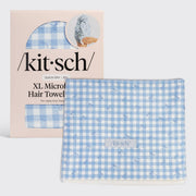 /kit·sch/ XL Microfiber Hair Towel in a light blue and white gingham pattern, shown next to its light pink packaging box.