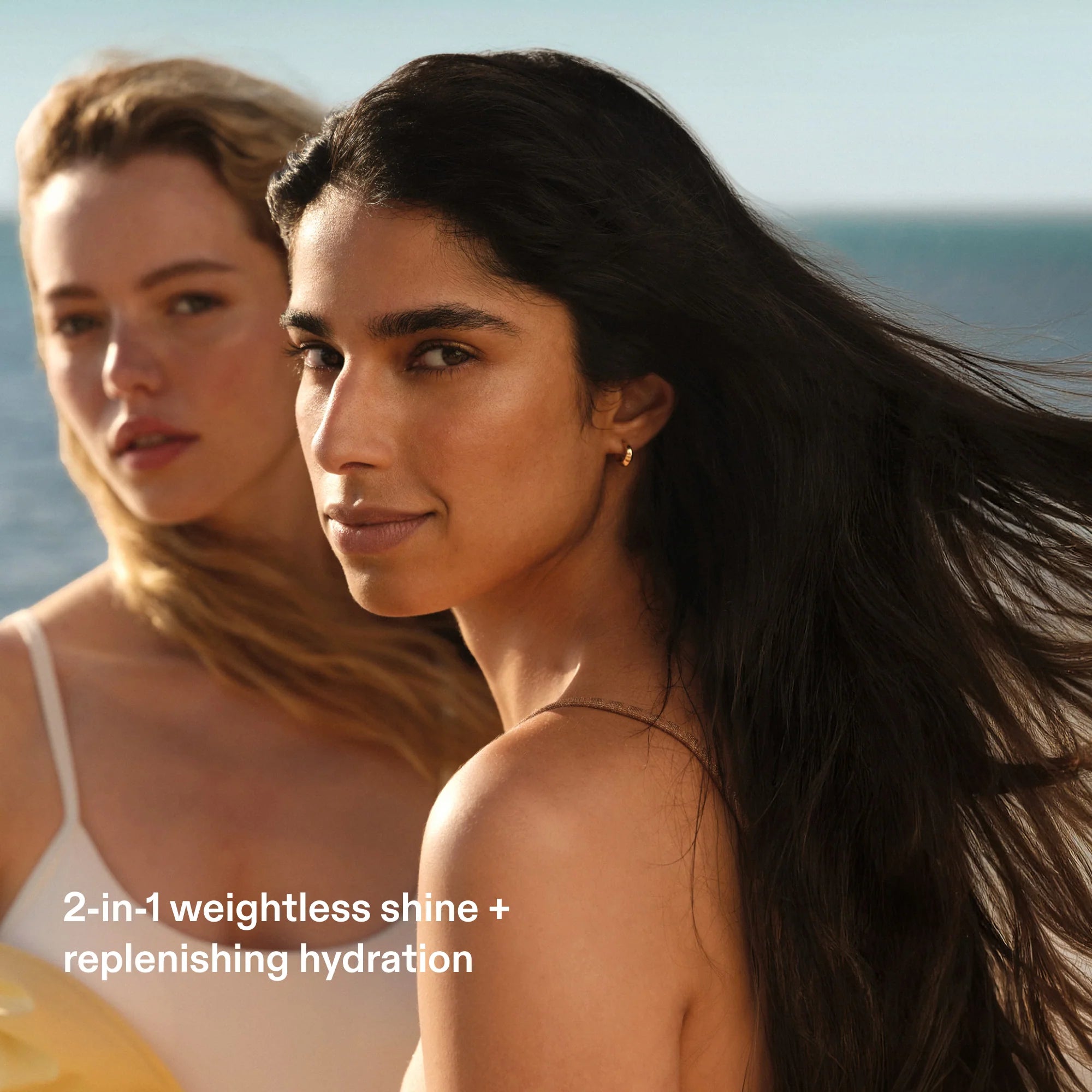 Models with smooth, glossy, hydrated hair showcasing the weightless shine and nourishment of Olaplex No.7 Shine Serum Oil Mist.