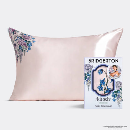 Kitsch X Bridgerton Pink satin pillowcase with floral design on a white background, featuring the Bridgerton Wisteria brand.