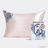 Kitsch X Bridgerton Pink satin pillowcase with floral design on a white background, featuring the Bridgerton Wisteria brand.