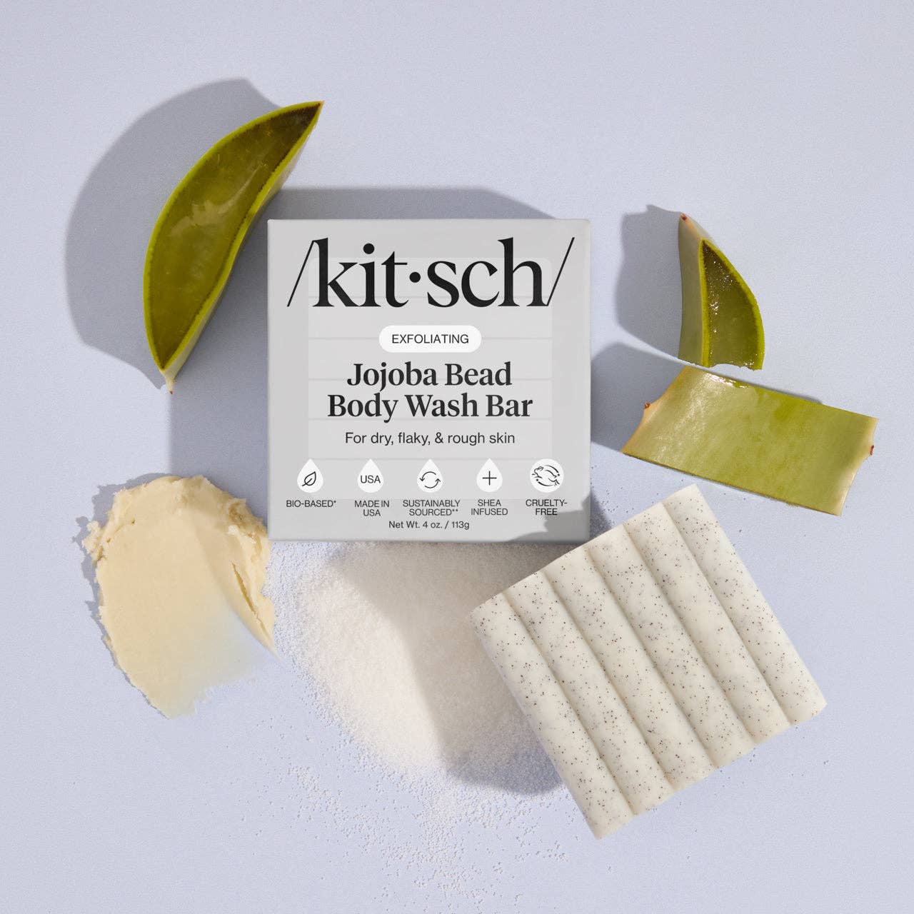 Kit'sch Jojoba Bead Body Wash Bar packaging with bars on a light gray background