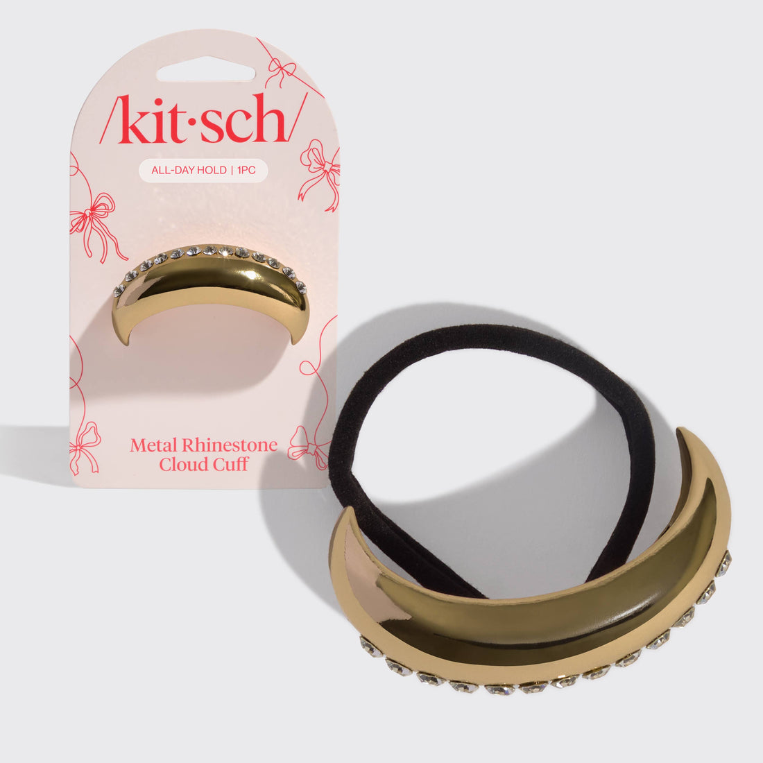 Kitsch Gold metal rhinestone cloud cuff with packaging on a white background