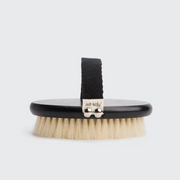 A Kitsch body dry brush with vegan bristles and a black handle, displayed on a white background.
