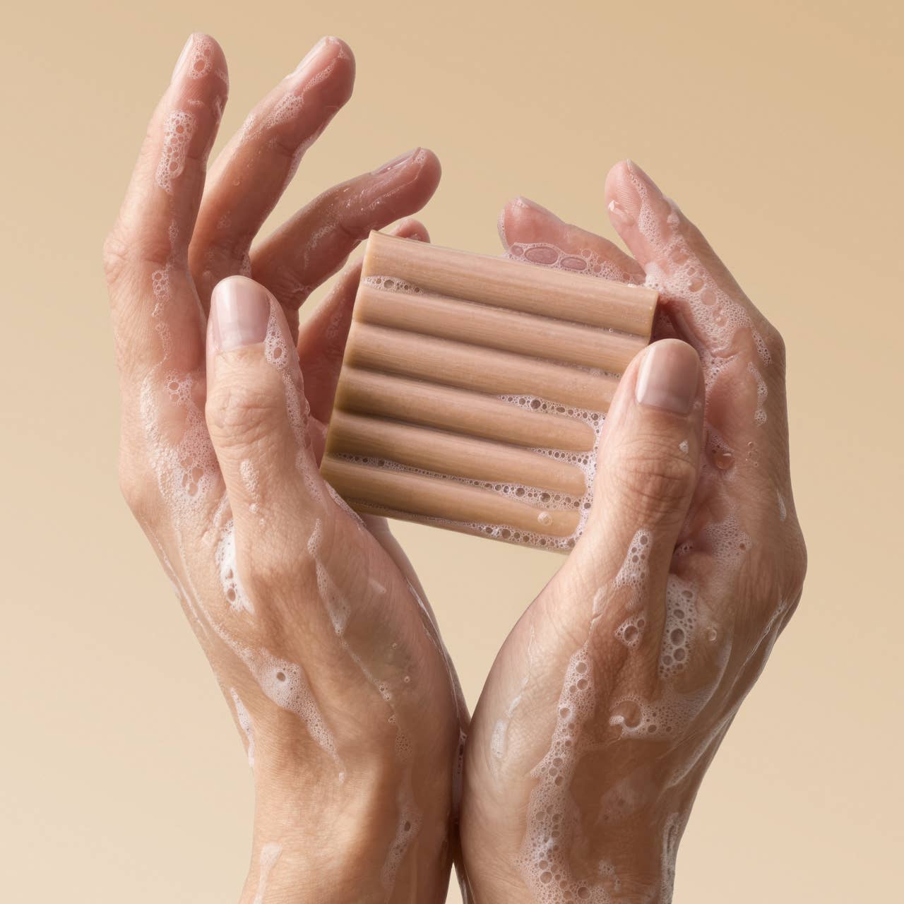 Hands holding Sulfate-free body wash bar for everyday cleansing