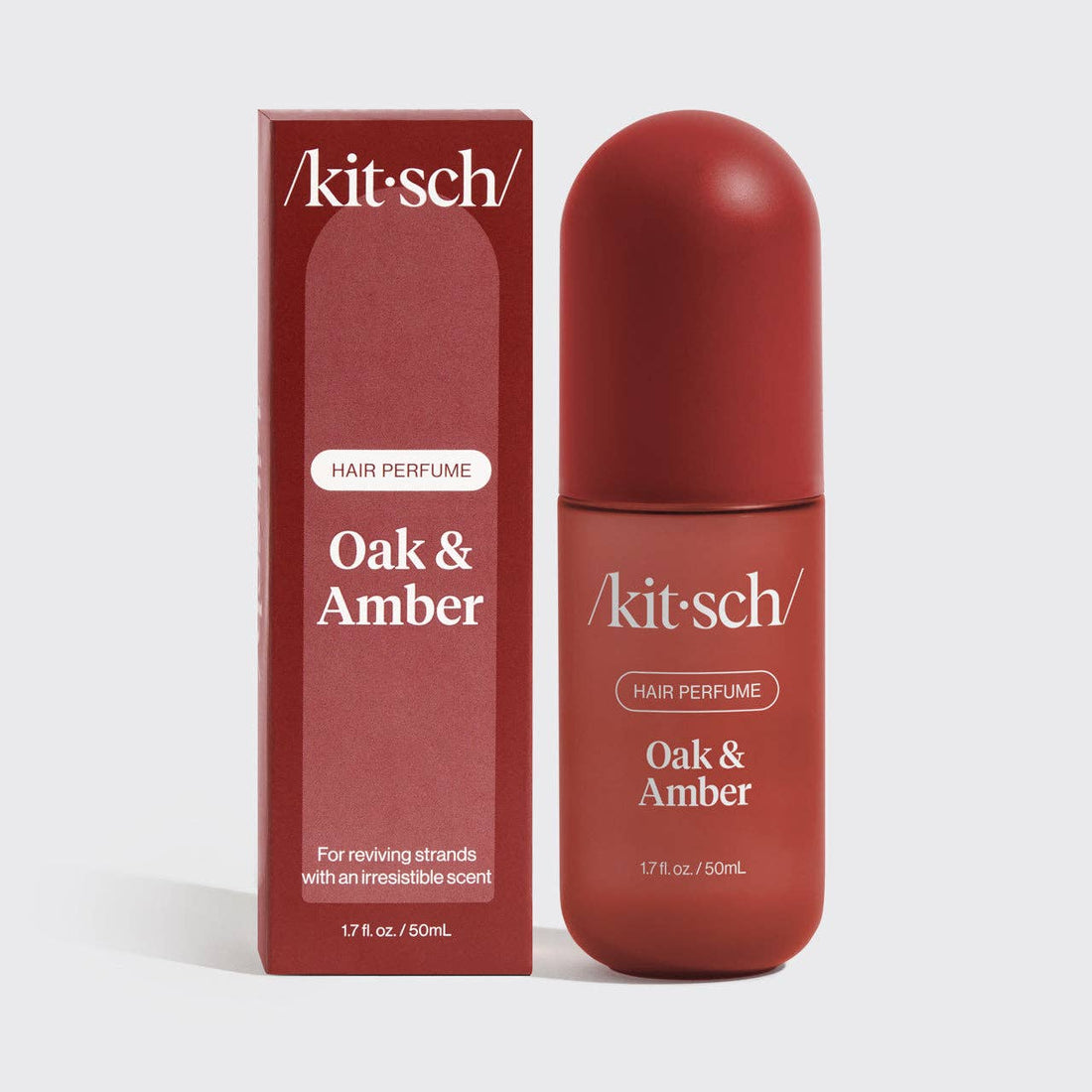Kitsch Oak &amp; Amber hair perfume bottle and packaging on a white background