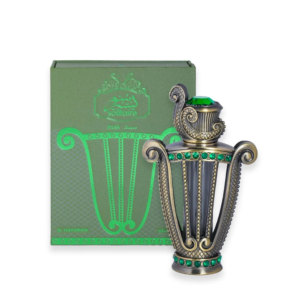 Al Haramain Solitaire Musk Concentrated Perfume Oil 12ml ornate green gemstone bottle displayed beside its matching green presentation box
