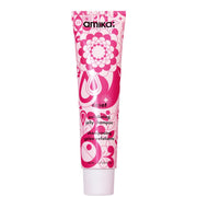 Amika Reset Exfoliating Jelly Shampoo 140ml pink patterned tube with targeted scalp applicator on a white background.