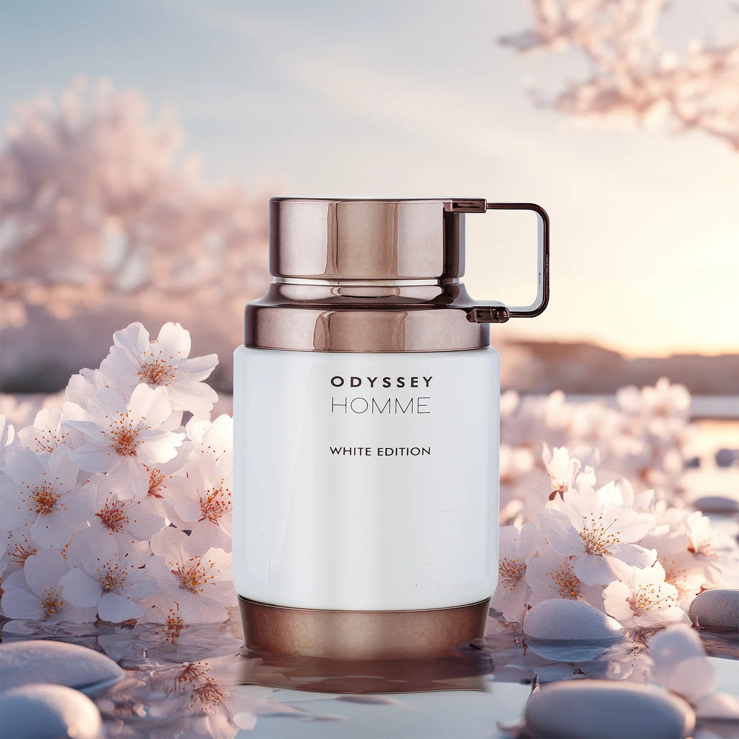 Armaf Odyssey Homme White Edition Eau De Parfum 100ml luxury men's fragrance displayed among white blossoms and smooth stones, highlighting its fresh, woody and aromatic scent profile.