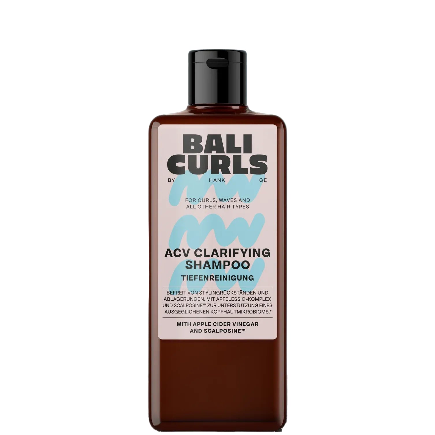 A bottle of Bali Curls ACV Clarifying Shampoo, featuring a dark amber-brown bottle and a black cap, set against a light blue arch background with white clouds.