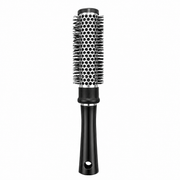 CS Beauty Thermal Radial Brush with ceramic vented barrel and ergonomic black handle for faster blow drying, adding volume, smoothing hair and creating soft curls on a white background.