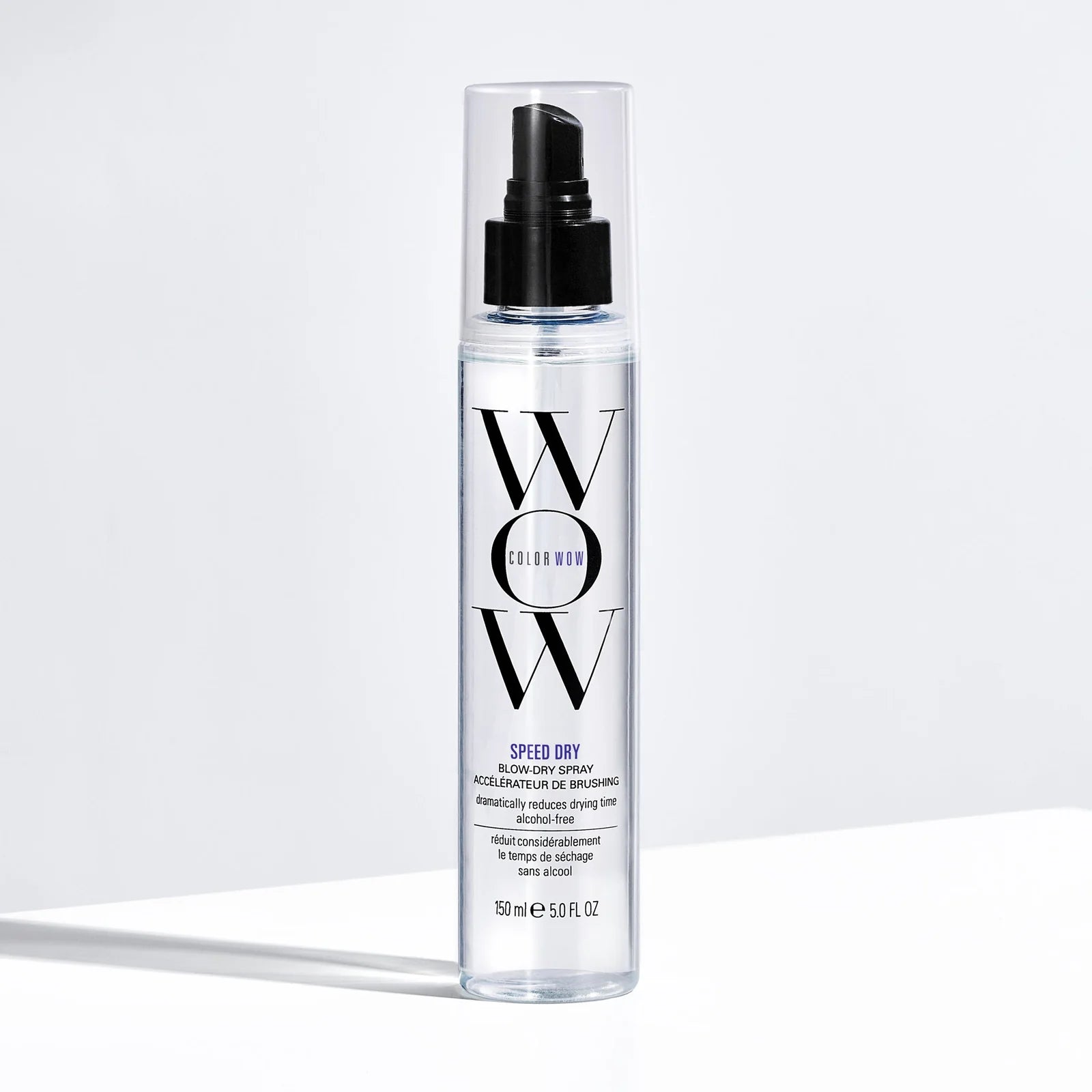 A bottle of Color Wow Speed Dry Blow-Dry Spray with a pump dispenser, labeled as 'alcohol-free', 'clinically proven', and 'new technology'.