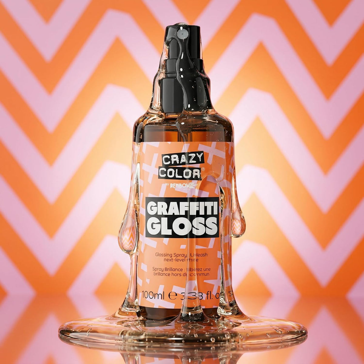 a texture visual of Crazy Color Graffiti Gloss Glossing Spray 100ml with the liquid leaking out the spray lid going down onto the product and a puddle of liquid at the bottom on a pink and orange triangular patterned background