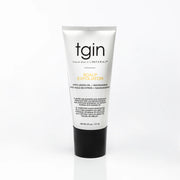 A tube of tgin Scalp Exfoliator with Lemon Oil and Nanonamide, featuring a white tube with black and gold text and a black cap, set against a plain white background.