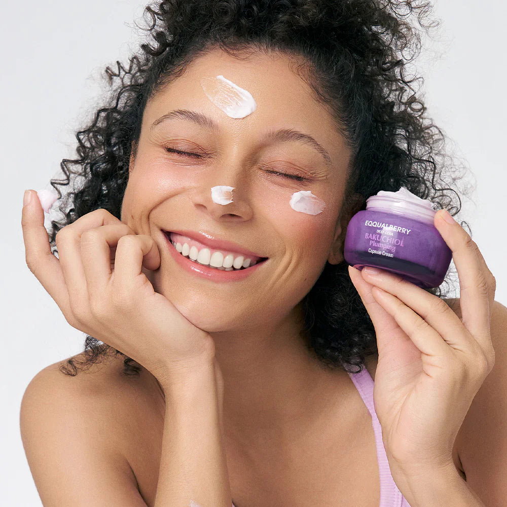 equalberry deep cera bakuchiol plumping capsule cream model with cream on forehead, tip of nose and left cheek