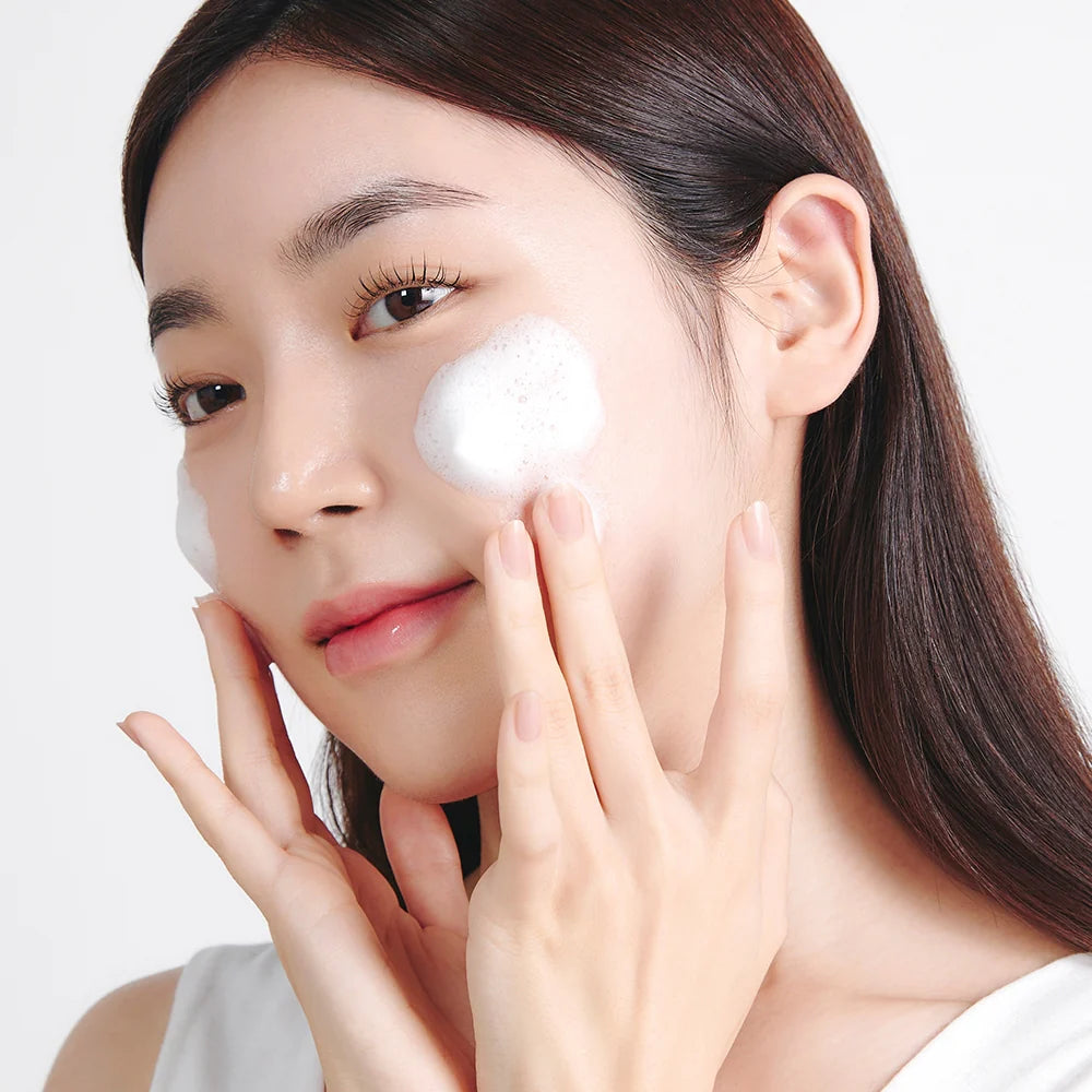 Etude House SoonJung pH 6.5 Whip Cleanser 250ml female applying product to face