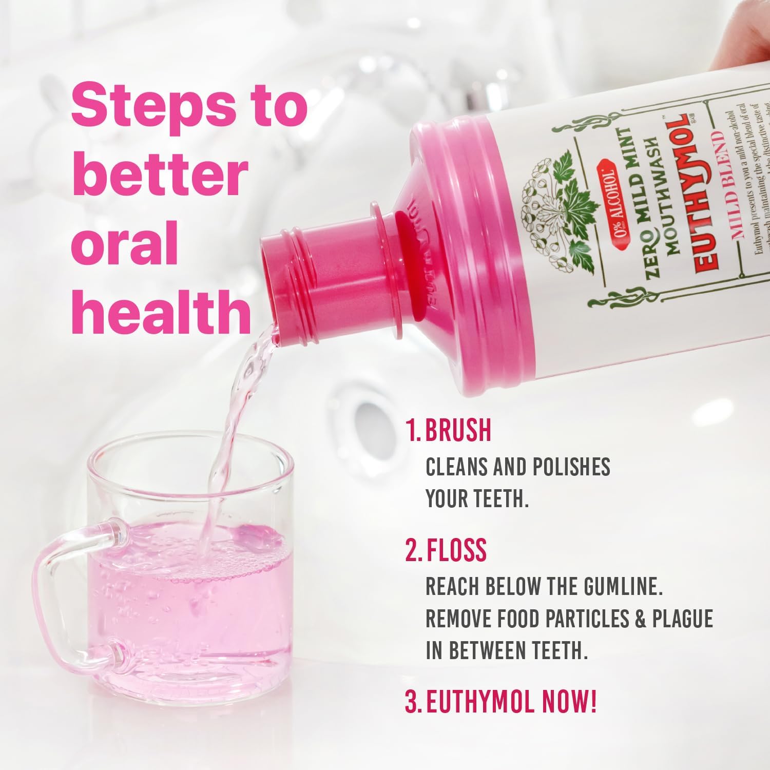 Euthymol Mild Mint Alcohol-Free Mouthwash bottle with pink neck pouring pink mouthwash into a glass against a bright white bathroom background, illustrating steps for better oral health.