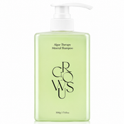 translucent light green crowsu algae therapy mineral shampoo bottle with a white pump on a clean white background, featuring minimalist packaging.