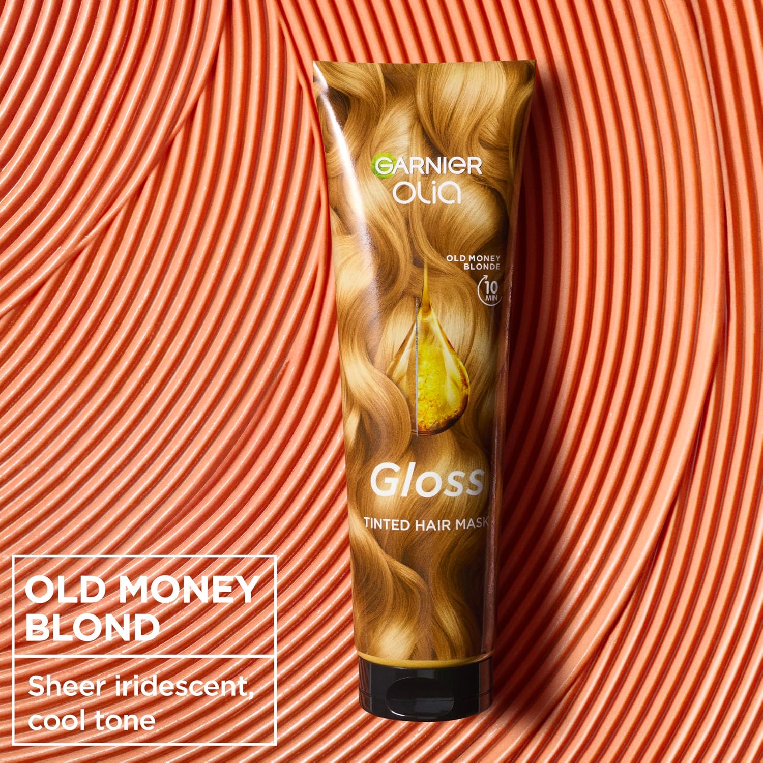 Garnier Olia Gloss Old Money Blonde Tinted Hair Mask 150ml on a peach textured background, refreshing blonde colour and enhancing glossy shine in 10 minutes.