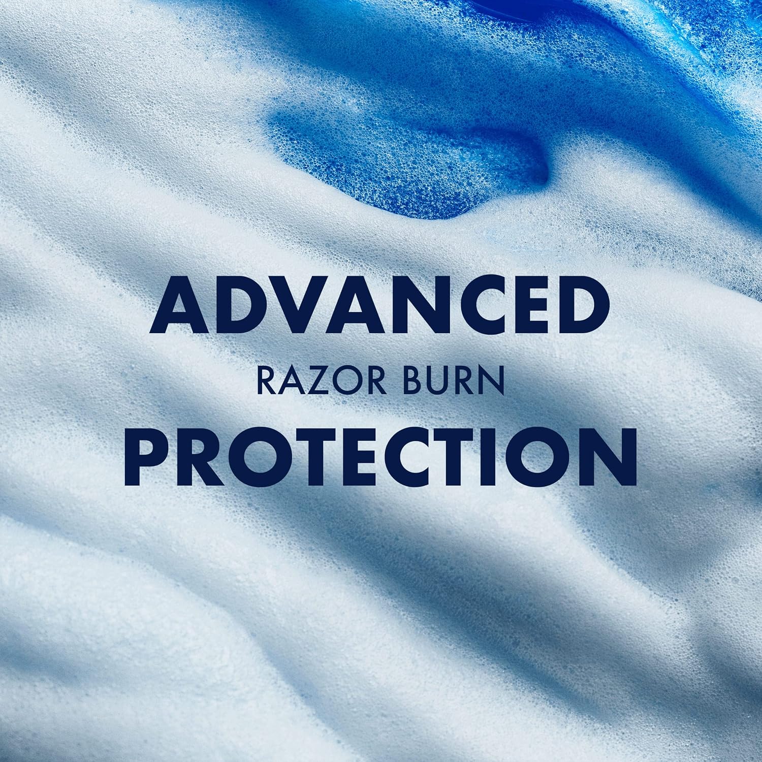 Close-up of blue and white shaving foam with text highlighting Gillette Fusion’s advanced razor-burn protection.
