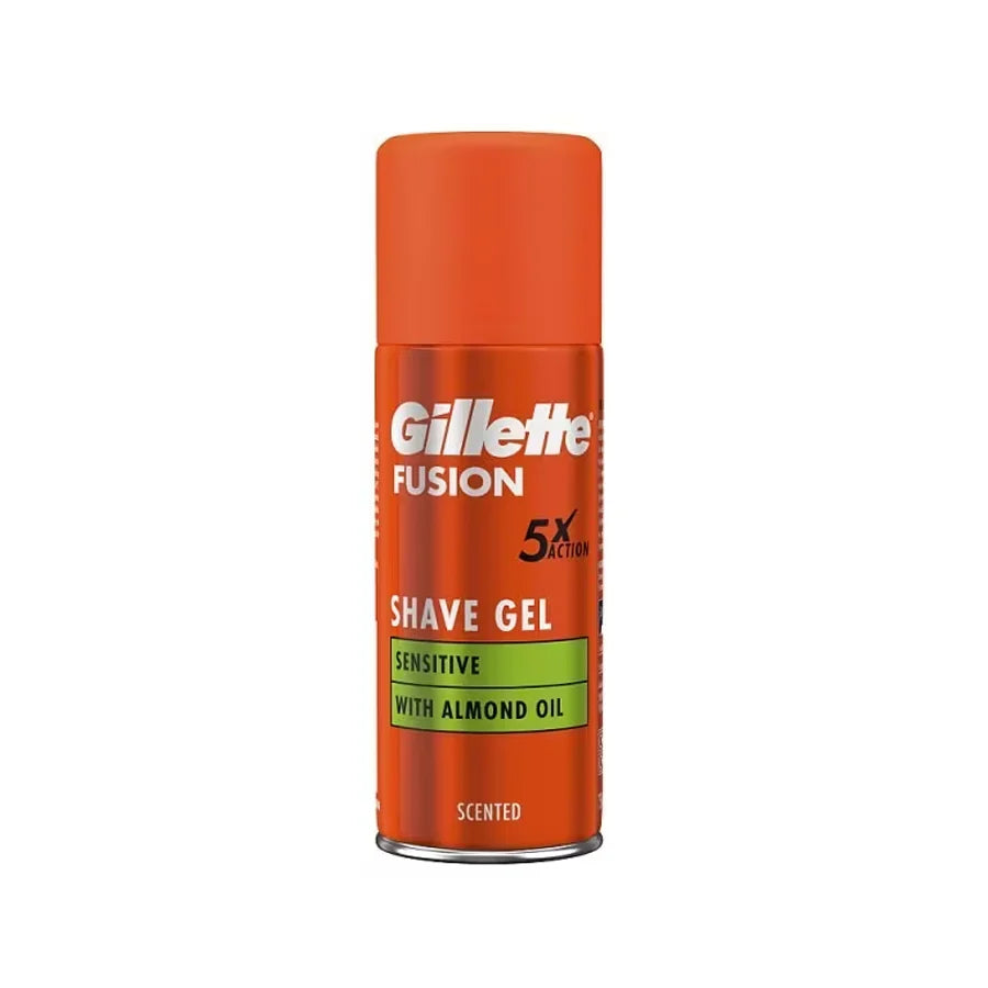 Gillette Fusion Sensitive Shave Gel 75ml orange aerosol can with matching cap, almond oil formula and 5x Action label, centred on a white background for a smooth, comfortable shave.
