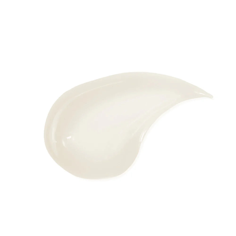 A smooth, glossy swatch of creamy makeup product, likely a liquid foundation or concealer, shown on a solid white background. Innersense Hair Renew Pre-Wash Scalp Treatment 2oz