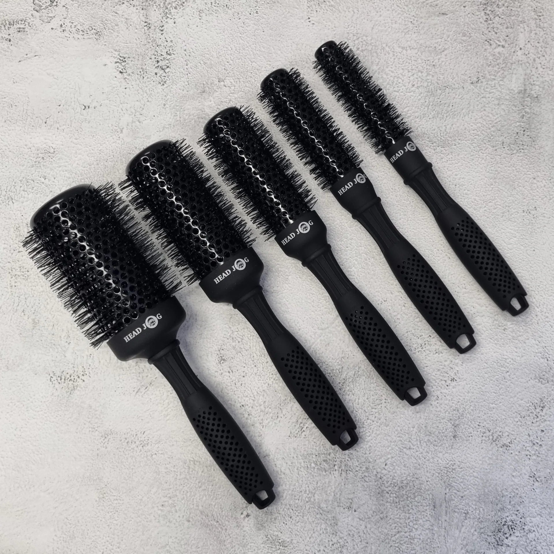 Head Jog Light Ceramic Radial Brush collection including 25mm, 33mm and 53mm lightweight ceramic round brushes for smooth blow dries, volume and curls.