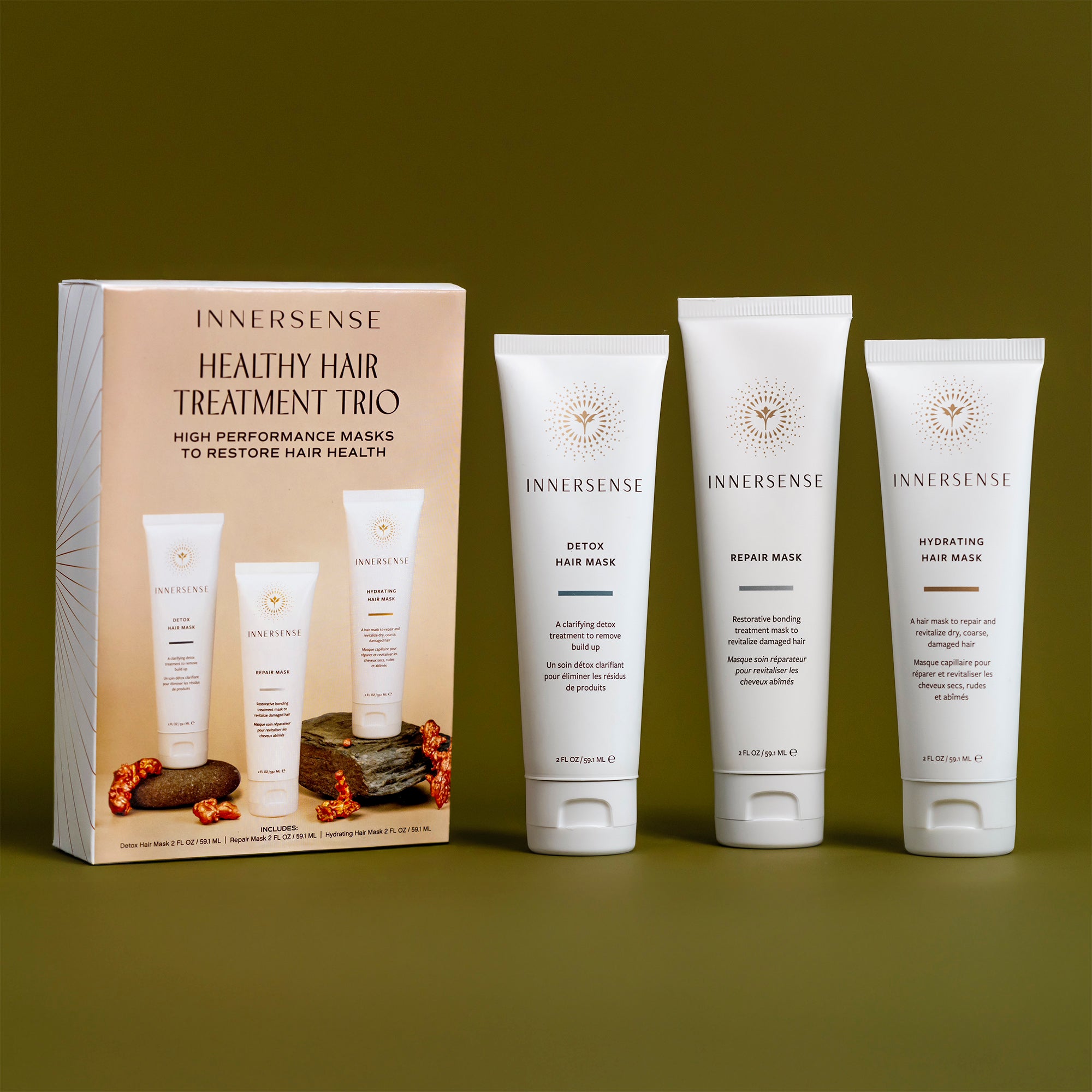Innersense Healthy Hair Treatment Trio on a green background