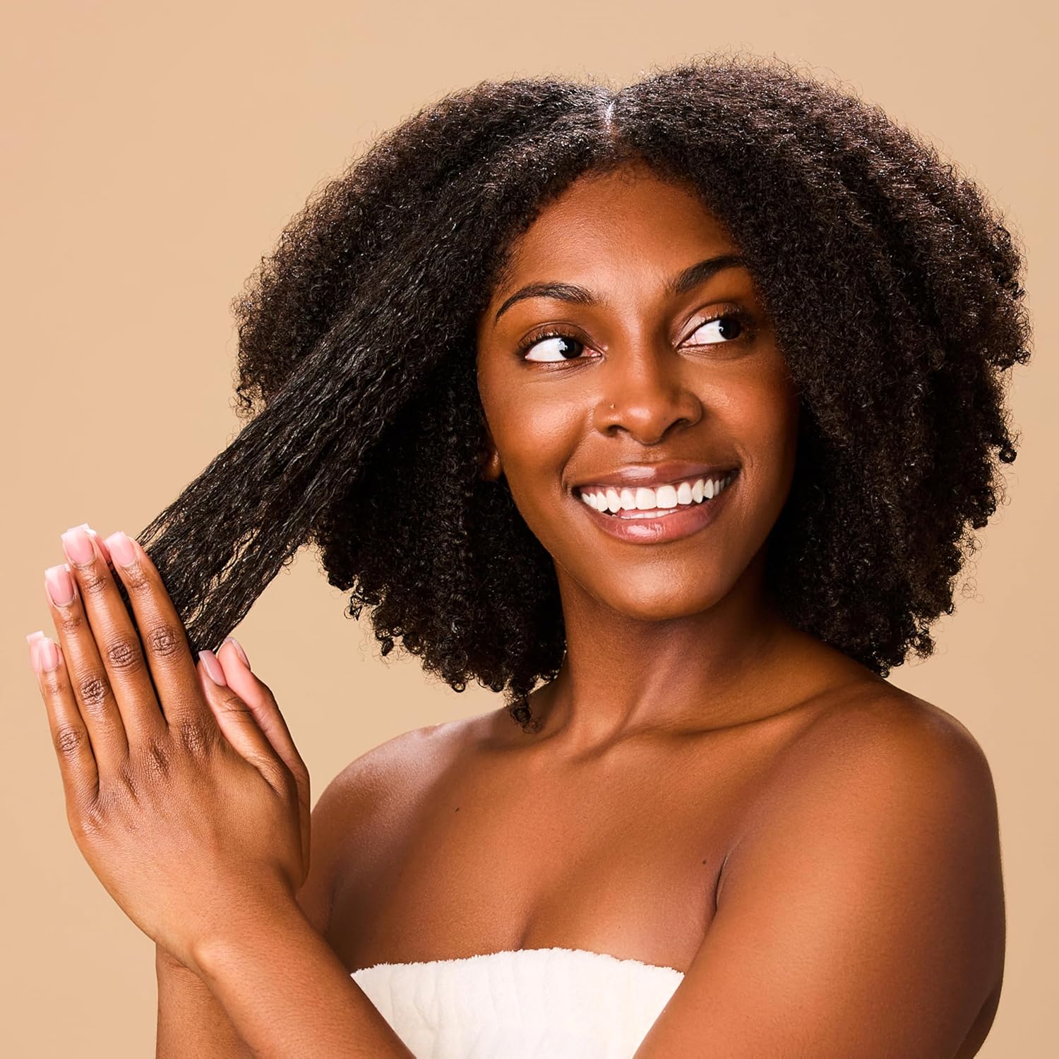 black woman applying Hollywood Beauty Tea Tree & Rosemary Nourishing Scalp & Hair Balm 8oz to hair