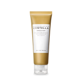 Skincare tube with gold and white design on a white background