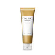 Skincare tube with gold and white design on a white background