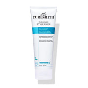 A white squeeze tube of Curlsmith In-Shower Style Fixer hair product, featuring blue and black text, set against a plain white background with a soft shadow.