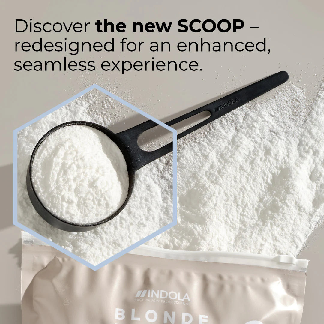 Indola Blonde Expert Lightener Up to 9+ Levels Of Lift White Powder 450g zoom in on scoop with powder