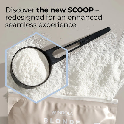 Indola Blonde Expert Lightener Up to 9+ Levels Of Lift White Powder 450g zoom in on scoop with powder