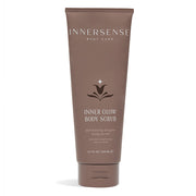 A tube of Innersense Inner Glow Body Scrub against a white background.