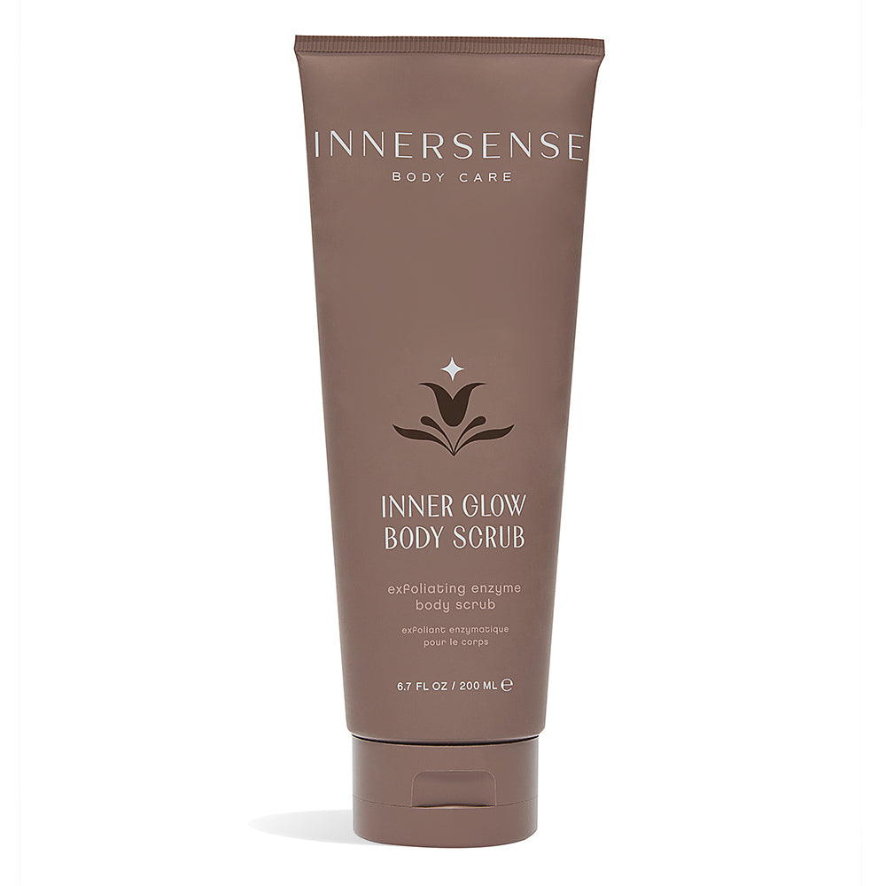 A tube of Innersense Inner Glow Body Scrub against a white background.