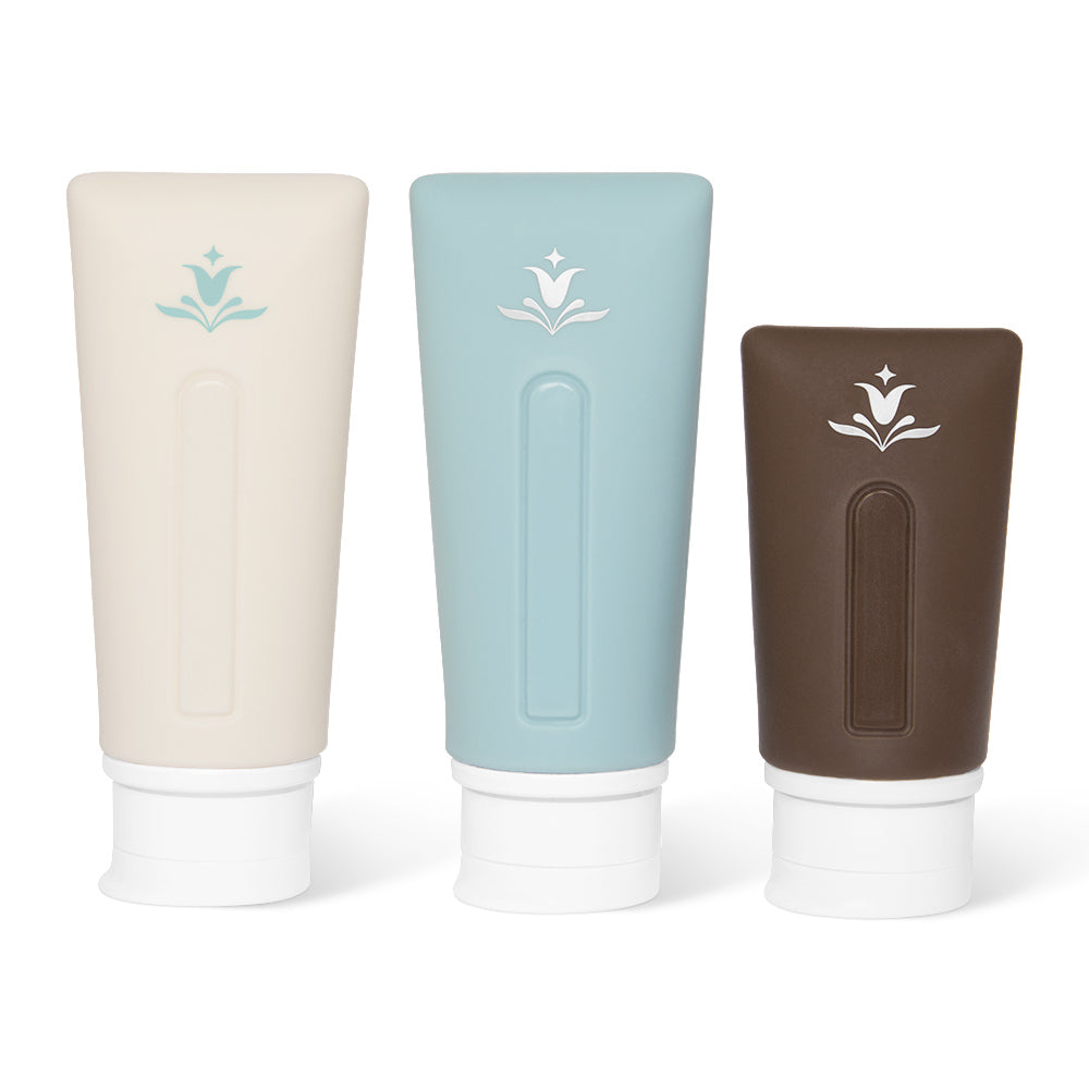 TSA-approved reusable travel tubes for haircare essentials. Innersense silicone refillable tubes